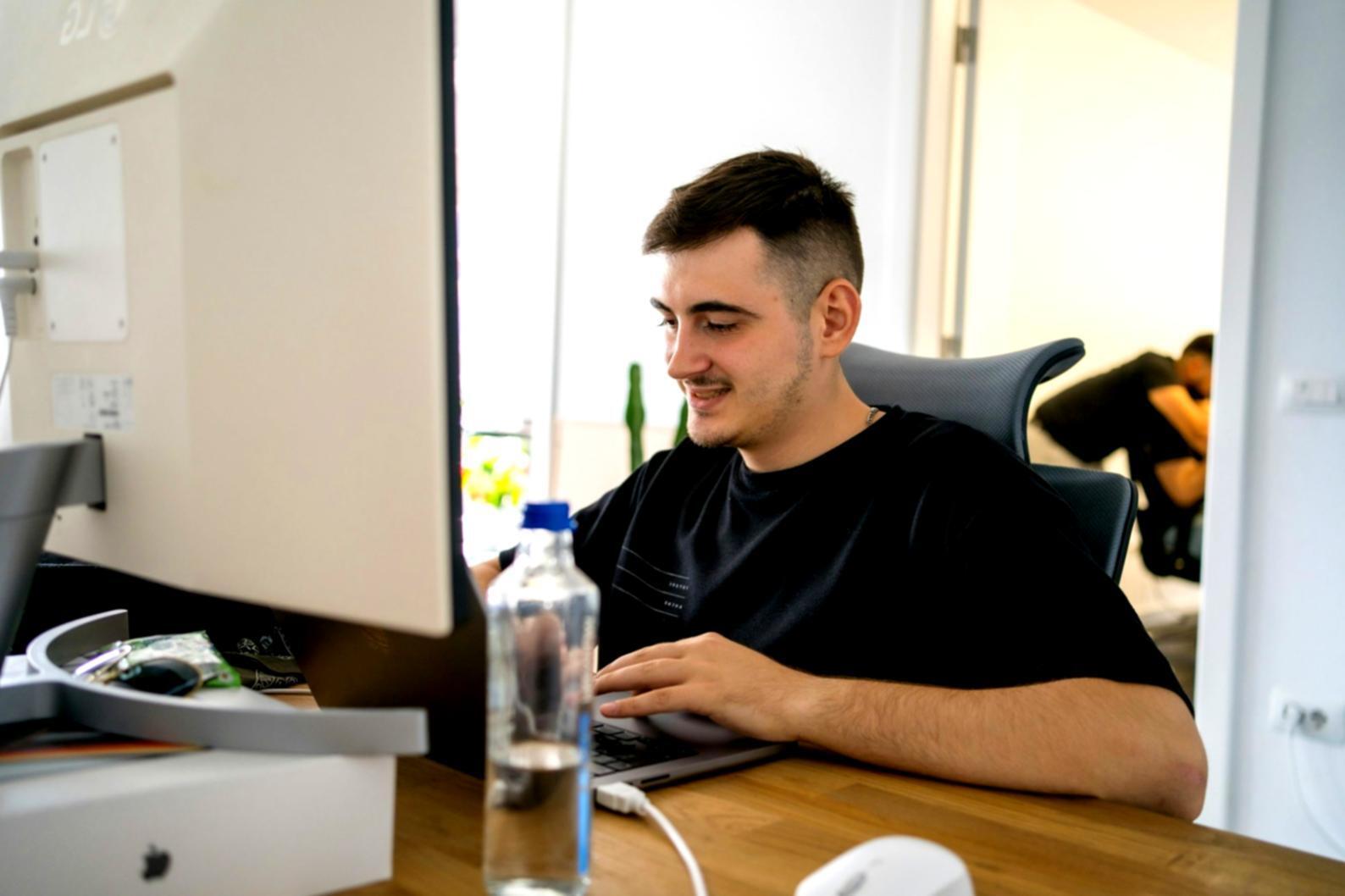 Business planning session with financial documents and laptop