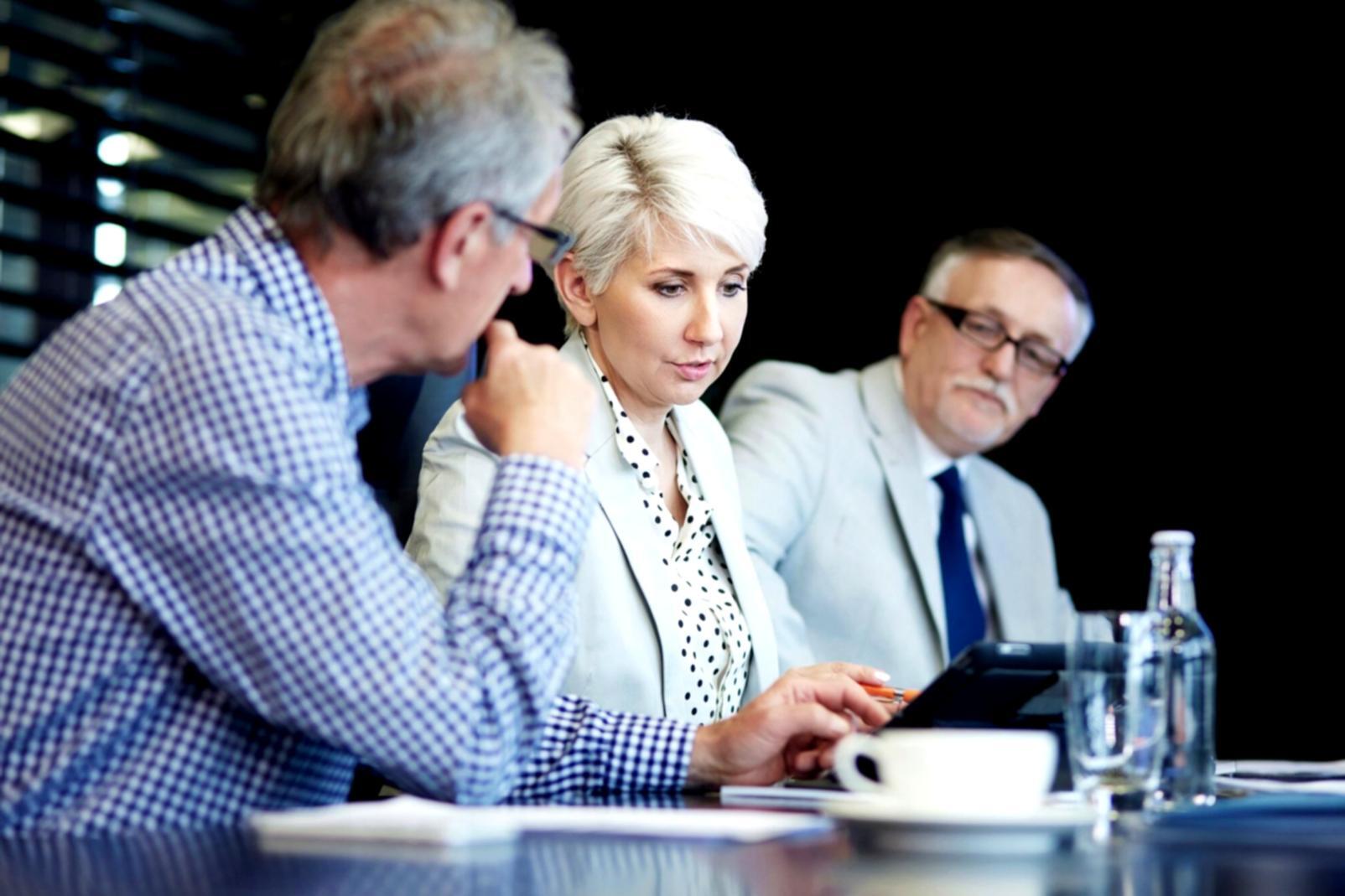 Entrepreneurs discussing business strategies in modern workspace